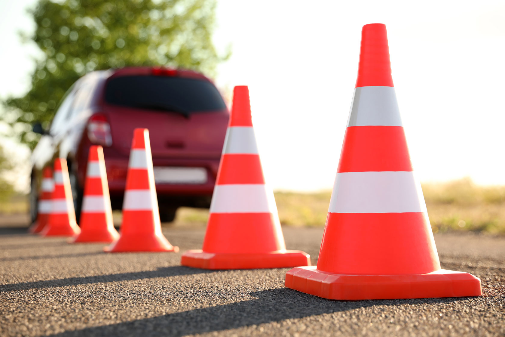 traffic-cones-near-car-outdoors-driving-1892841982