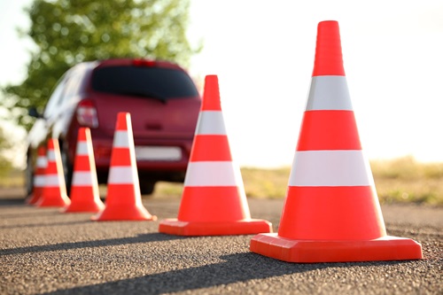 traffic-cones-near-car-outdoors-driving-1892841982