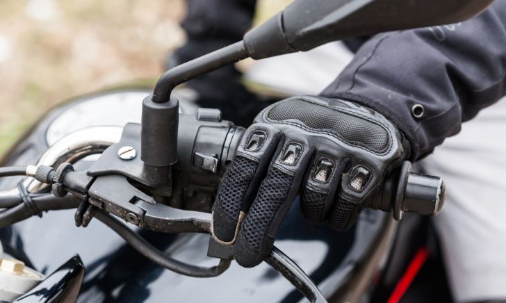 A motorcyclist highlighting the importance of brake maintenance for safety