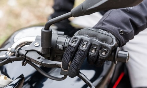 A motorcyclist highlighting the importance of brake maintenance for safety